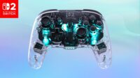 https://www.nintendo-difference.com/wp-content/uploads/2026/06/1_MediaGallery_NSW_Afterglow_Wireless_Clear_Badge_2400x1350_59465fd7-7cd5-4b96-8c06-b281c7bba628.jpg
